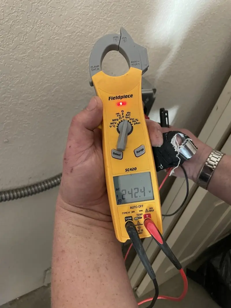 Voltage testing with clamp meter during Electrical Installation Services in Ephrata